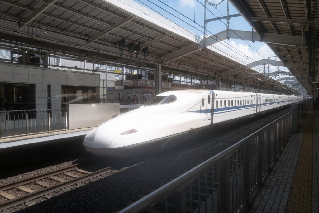 Shinkansen bullet train at Japanese station, ideal for fast travel on Japan tours.