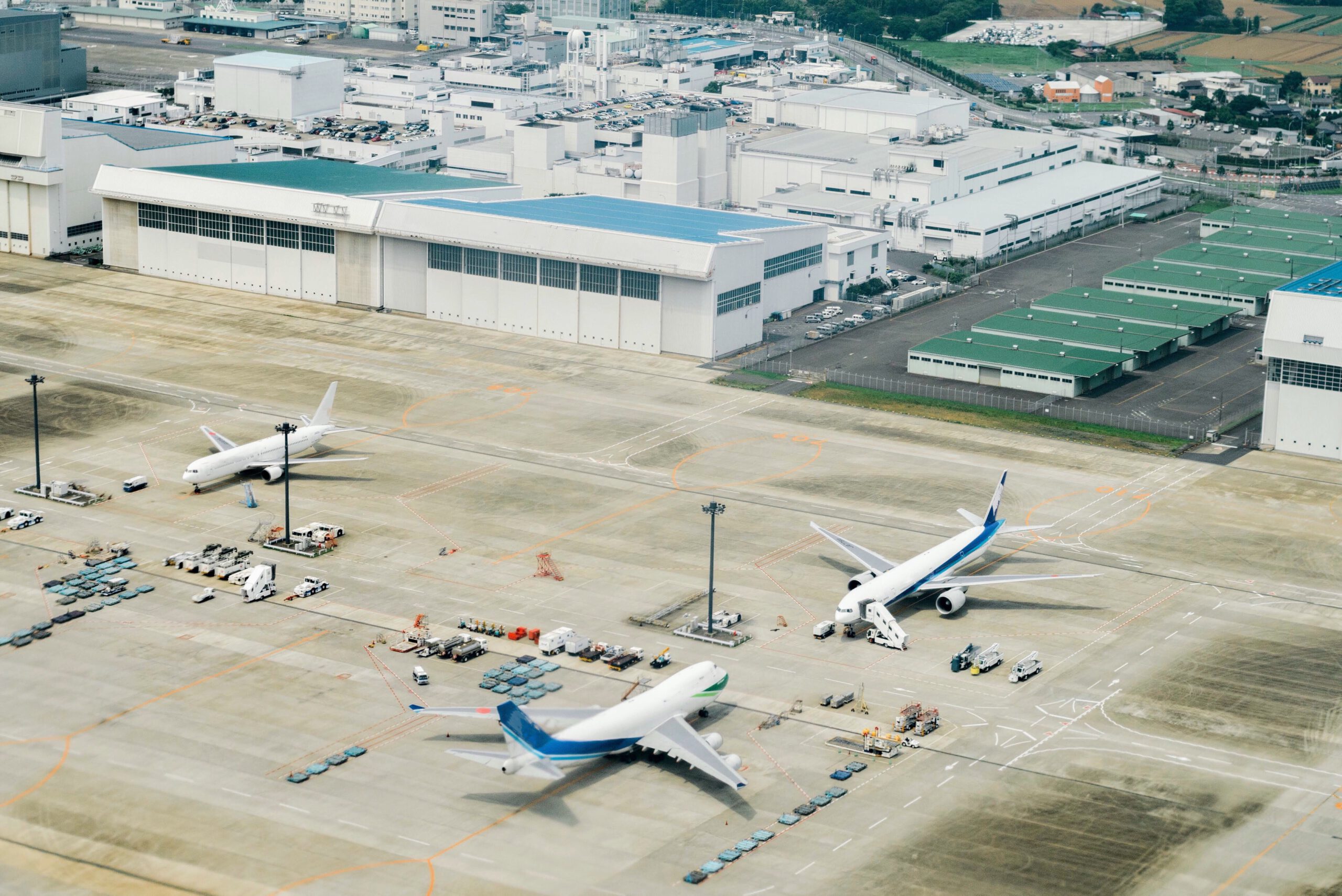 Japanese airport runway with planes ready for departure on a scenic tour of Japan.