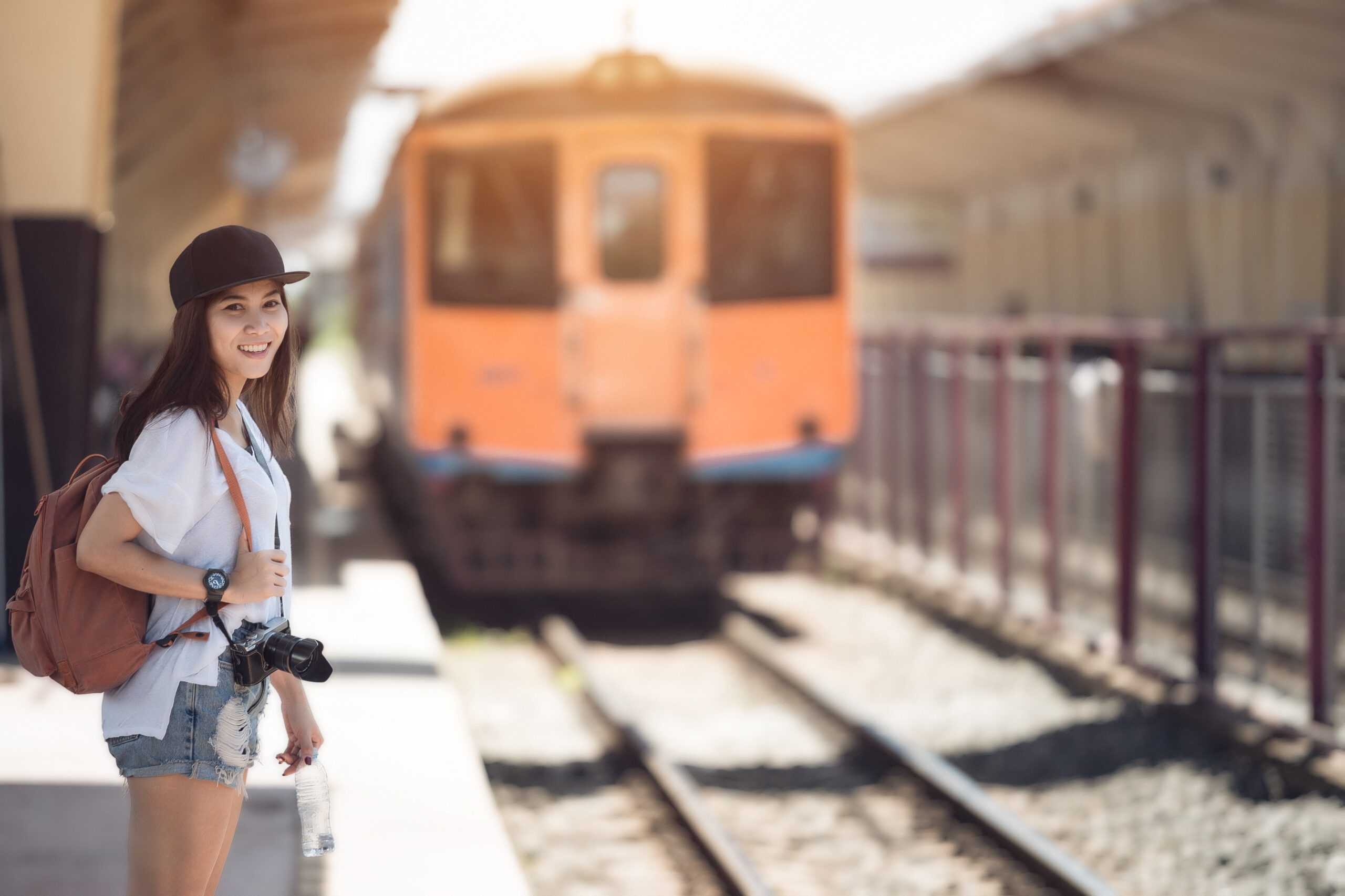 Traveler at a Japanese train station ready for an adventure. Perfect starting point for Japan tours!