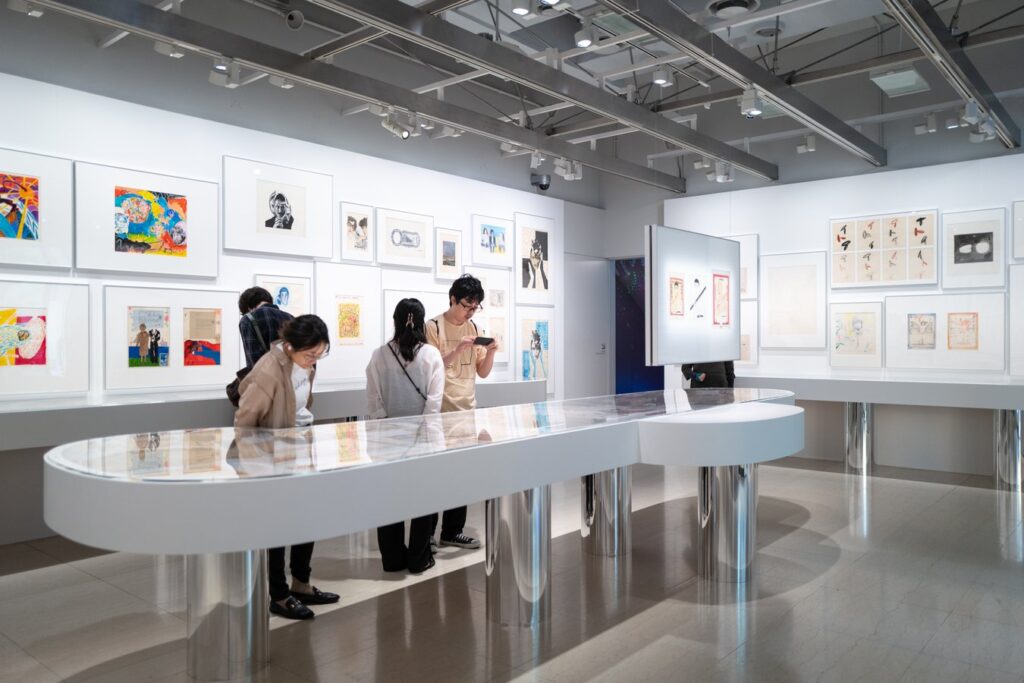Visitors exploring a modern art gallery in Japan, highlighting contemporary exhibits during a cultural tour.