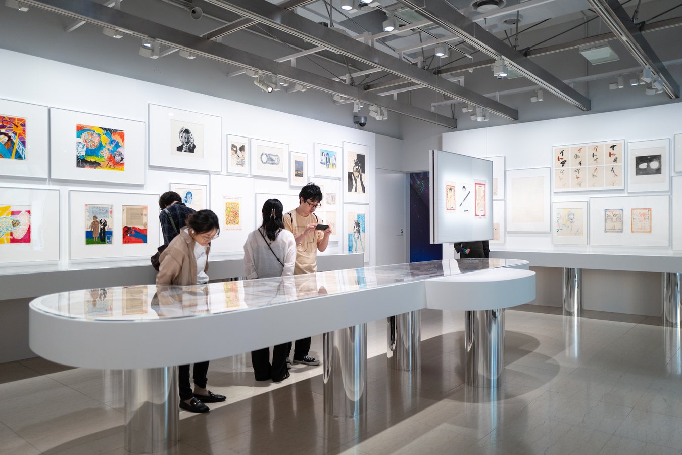 Visitors exploring a modern art gallery in Japan, highlighting contemporary exhibits during a cultural tour.