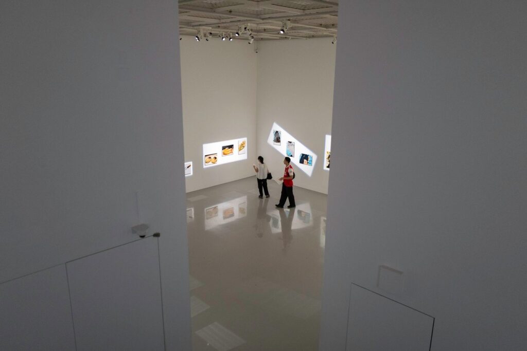 Visitors exploring a modern art gallery in Japan, highlighting contemporary culture on a Japan tour.