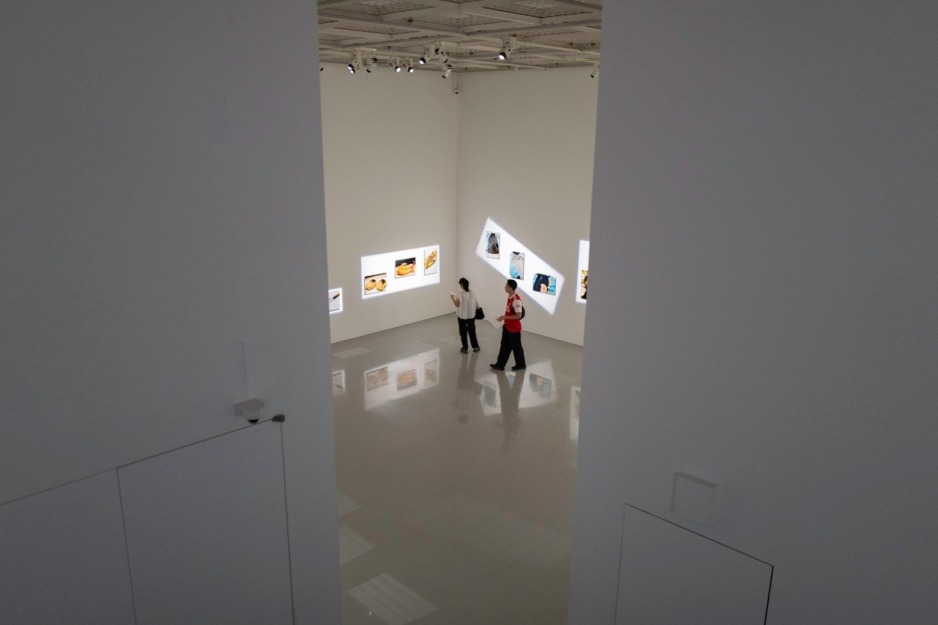 Visitors exploring a modern art gallery in Japan, highlighting contemporary culture on a Japan tour.
