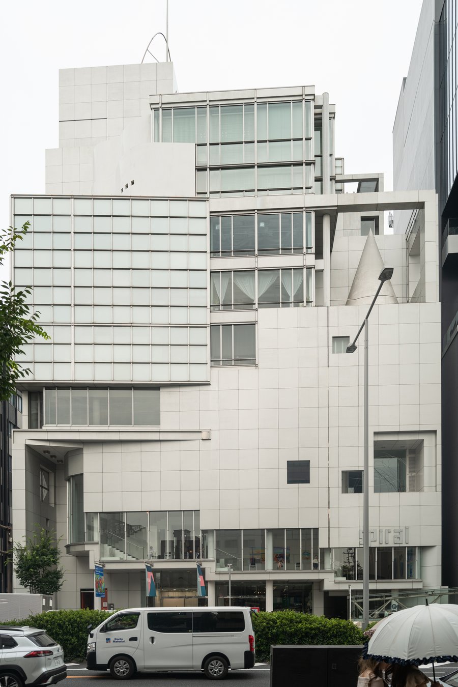 Modern architectural building in Tokyo, Japan on a cloudy day, showcasing urban design for tourists exploring Japan.