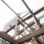 Contemporary architecture meets traditional wooden structures in Japan's urban landscape.