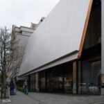 Modern shopping street in Japan with contemporary architecture, ideal for urban exploration on Japan tours.