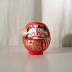 Daruma doll on display, symbolizing perseverance and luck, perfect for authentic Japan tour experiences.