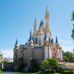 Enchanting castle at Tokyo Disneyland under blue sky - perfect stop on your Japan tour adventure.