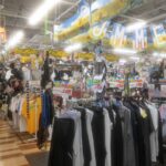 Colorful Japanese shop offering summer clothes and accessories during a tour of vibrant Japan shopping districts.