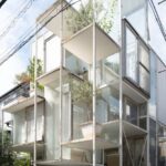 Modern glass architecture in Japan, showcasing innovative design on a Japan tour.