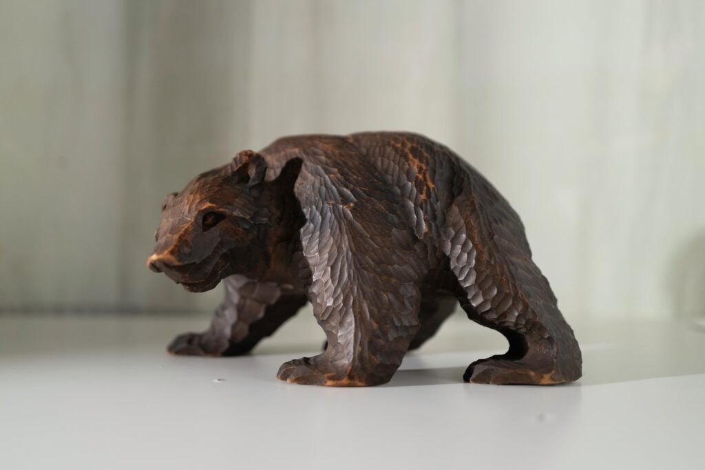 Hand-carved bear sculpture from Hokkaido, Japan, showcasing local craftsmanship on a Japan tour.