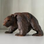 Hand-carved bear sculpture from Hokkaido, Japan, showcasing local craftsmanship on a Japan tour.