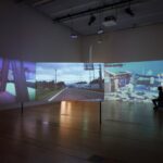 Immersive digital exhibition during a Japan tour, featuring scenic landscapes and modern art projections.
