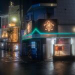 Moody night street view in Japan, featuring vibrant neon lights and urban architecture. Perfect for exploring Tokyo nightlife.