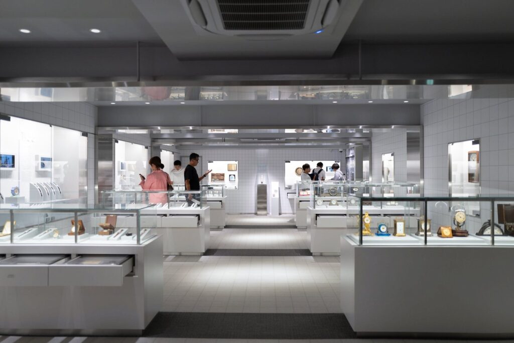 Modern museum exhibition in Japan showcasing clocks and artifacts for cultural tours and exploration.