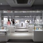 Modern museum exhibition in Japan showcasing clocks and artifacts for cultural tours and exploration.